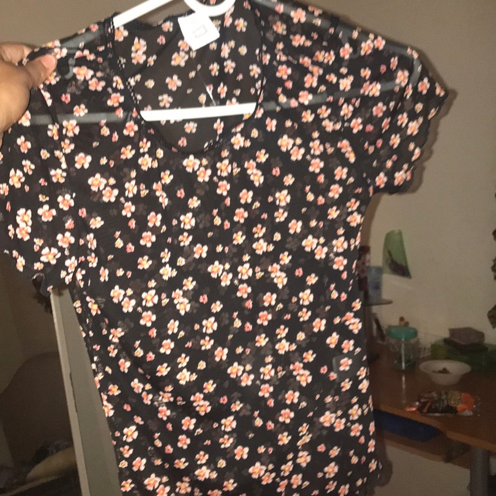 A see through flower shirt from pacsun.